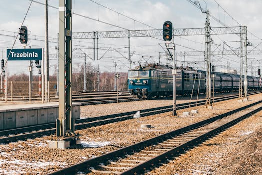Cargo train at Trzebinia railway station in Poland, showcasing transport infrastructure.