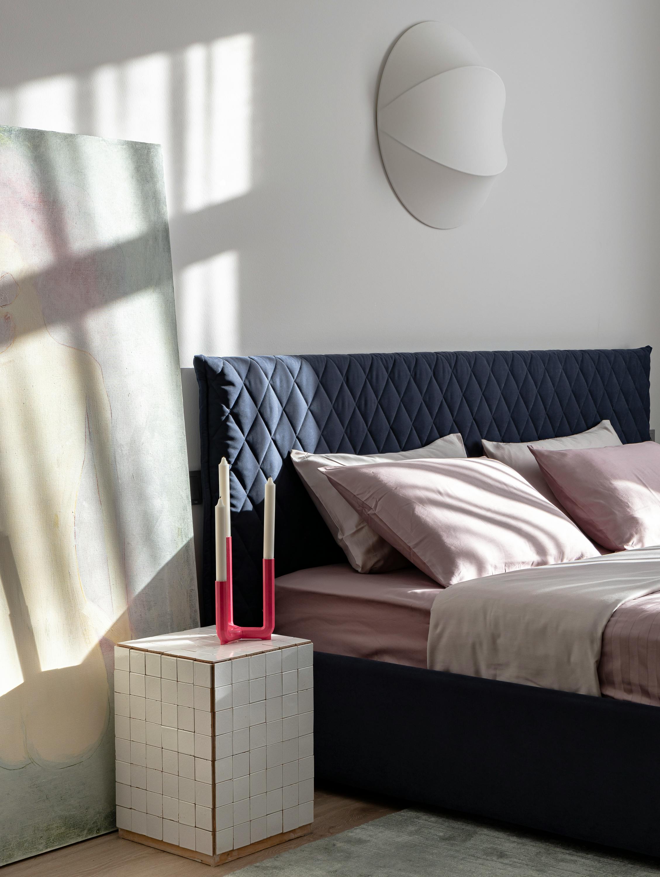 Stylish modern bedroom featuring elegant furniture and soft natural lighting.