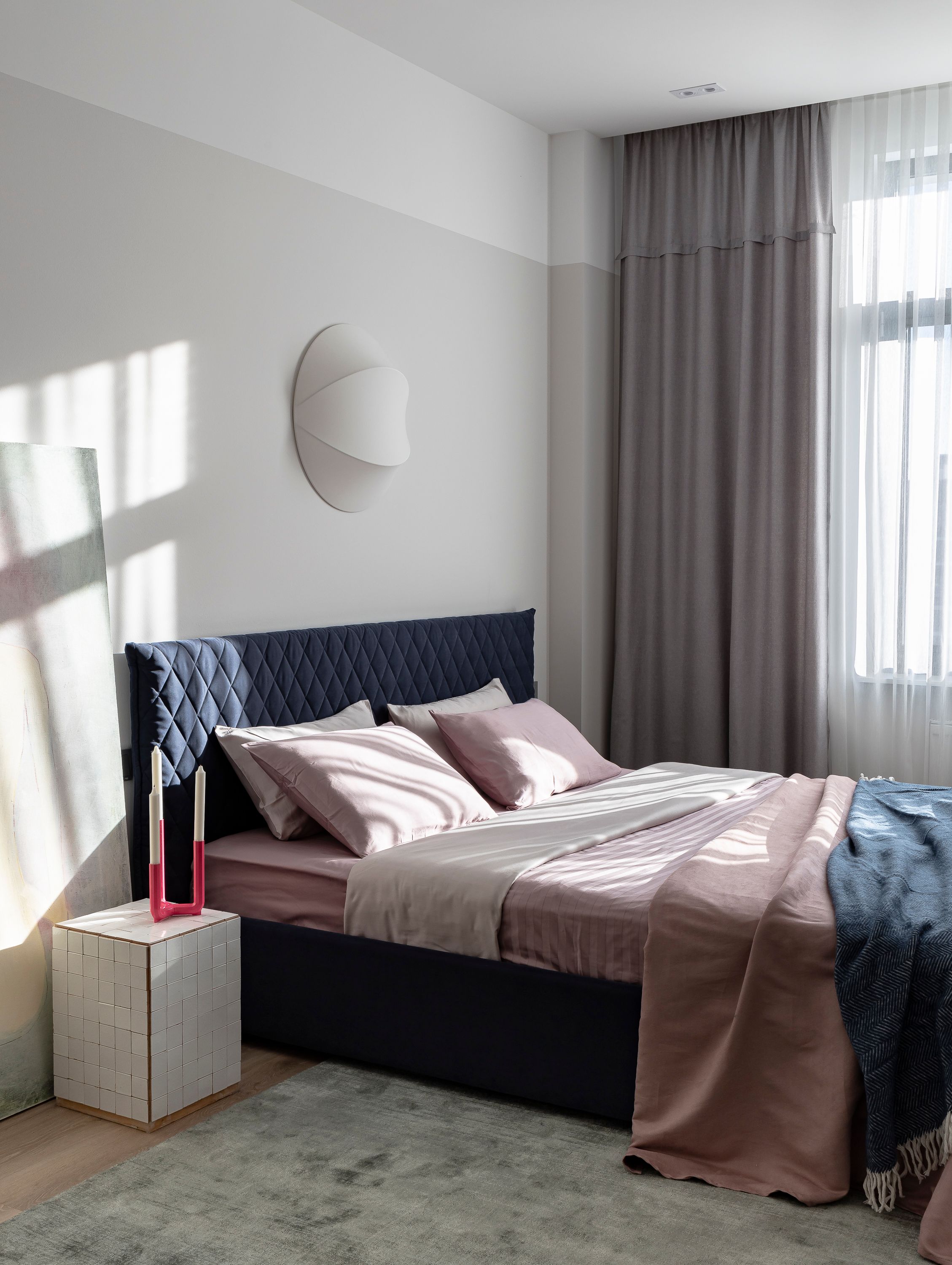 Elegantly designed bedroom featuring a modern and minimalist aesthetic.