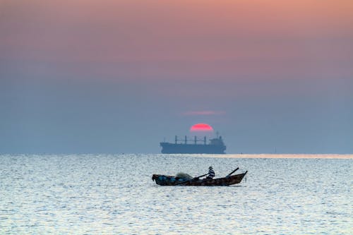Безкоштовне стокове фото на тему «веслування, горизонт, Захід сонця»
