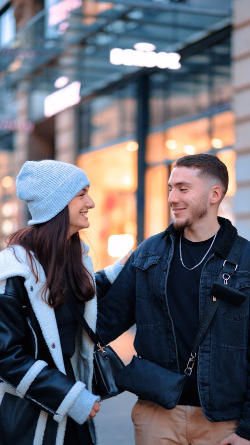 Young Couple Standing Face to Face and Smiling 