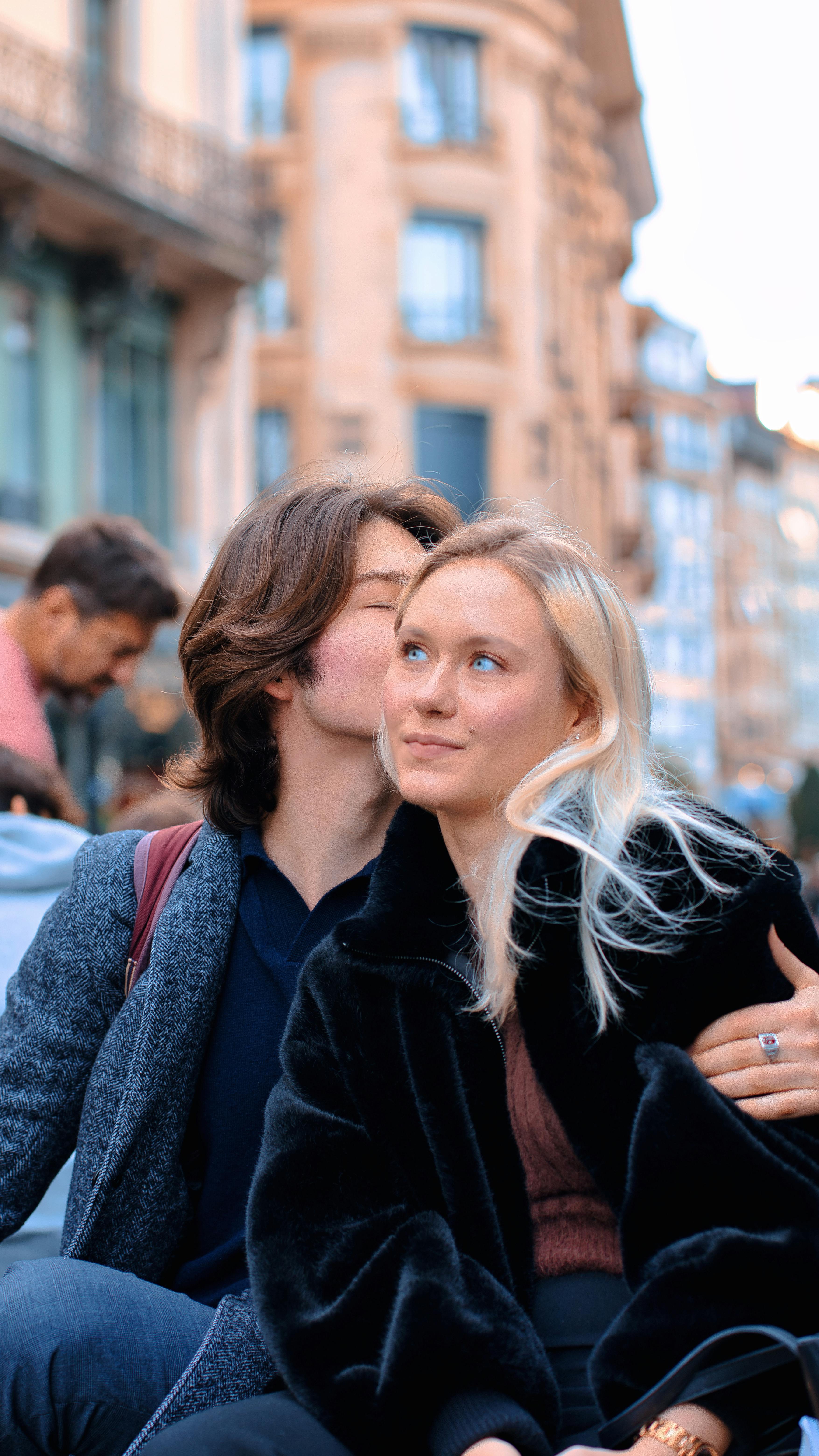 Boyfriend Kissing his Girlfriend on a Cheek · Free Stock Photo