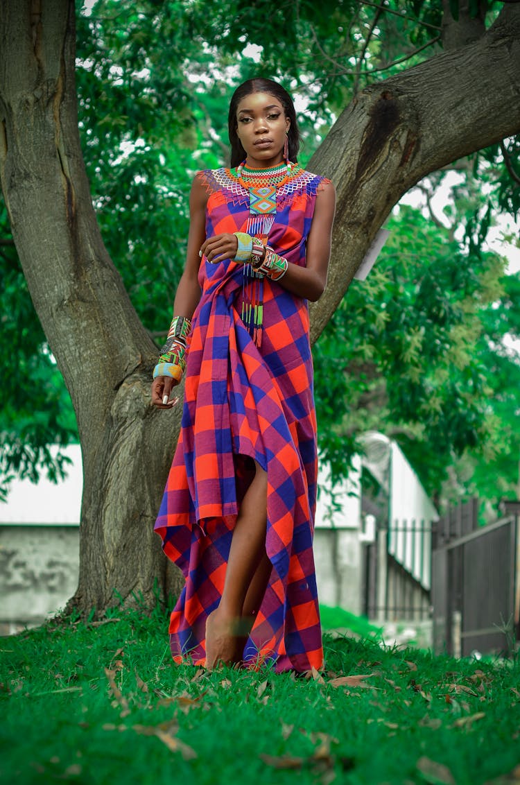 Model Wearing Jewelry To Long Checked Dress