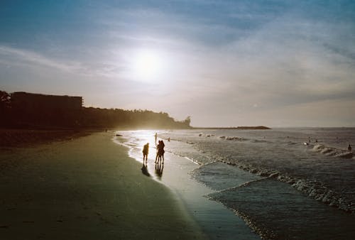 Sunlight over People on Beach