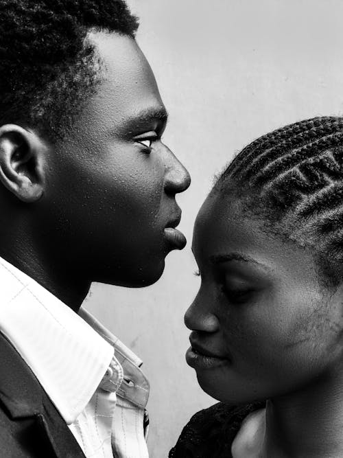 Free Portrait of a Young Couple Standing Face to Face  Stock Photo