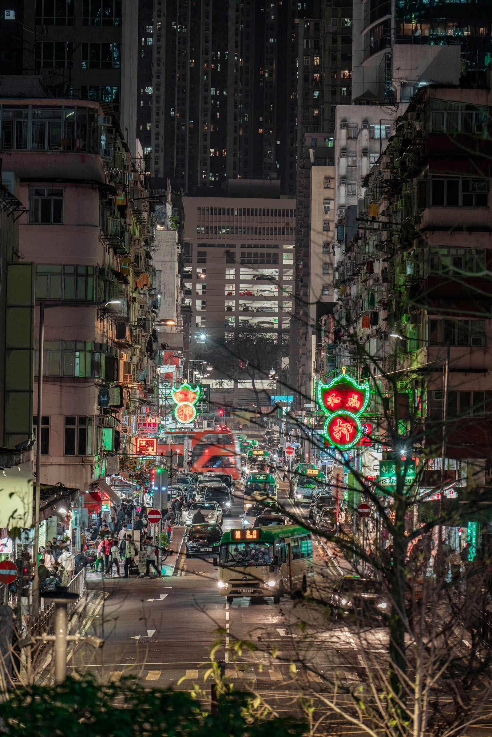 Busy neon-lit Hong Kong street at night
