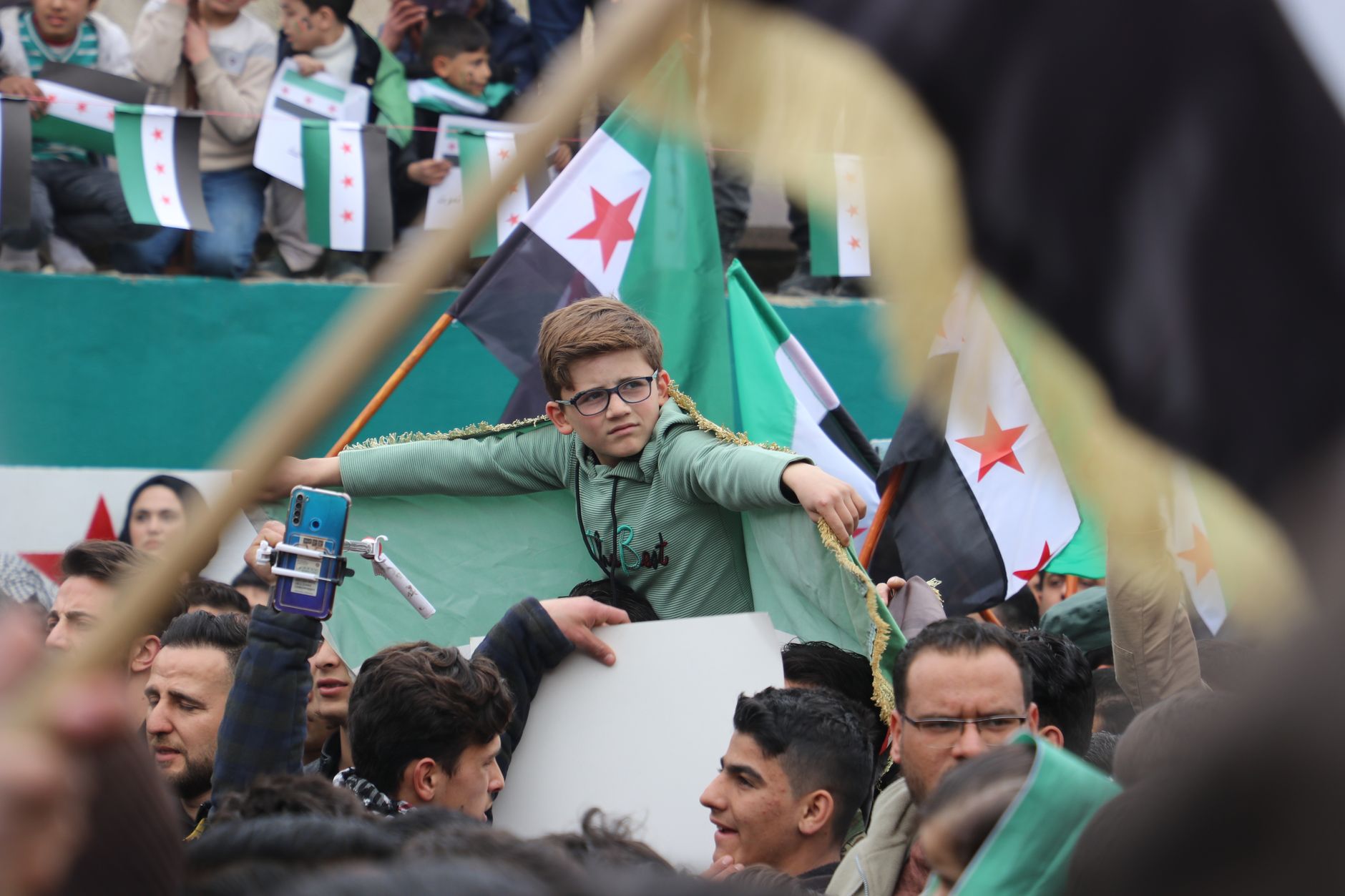 Algeria supporters waving national flags outside Nelson Mandela Stadium before a qualifying match