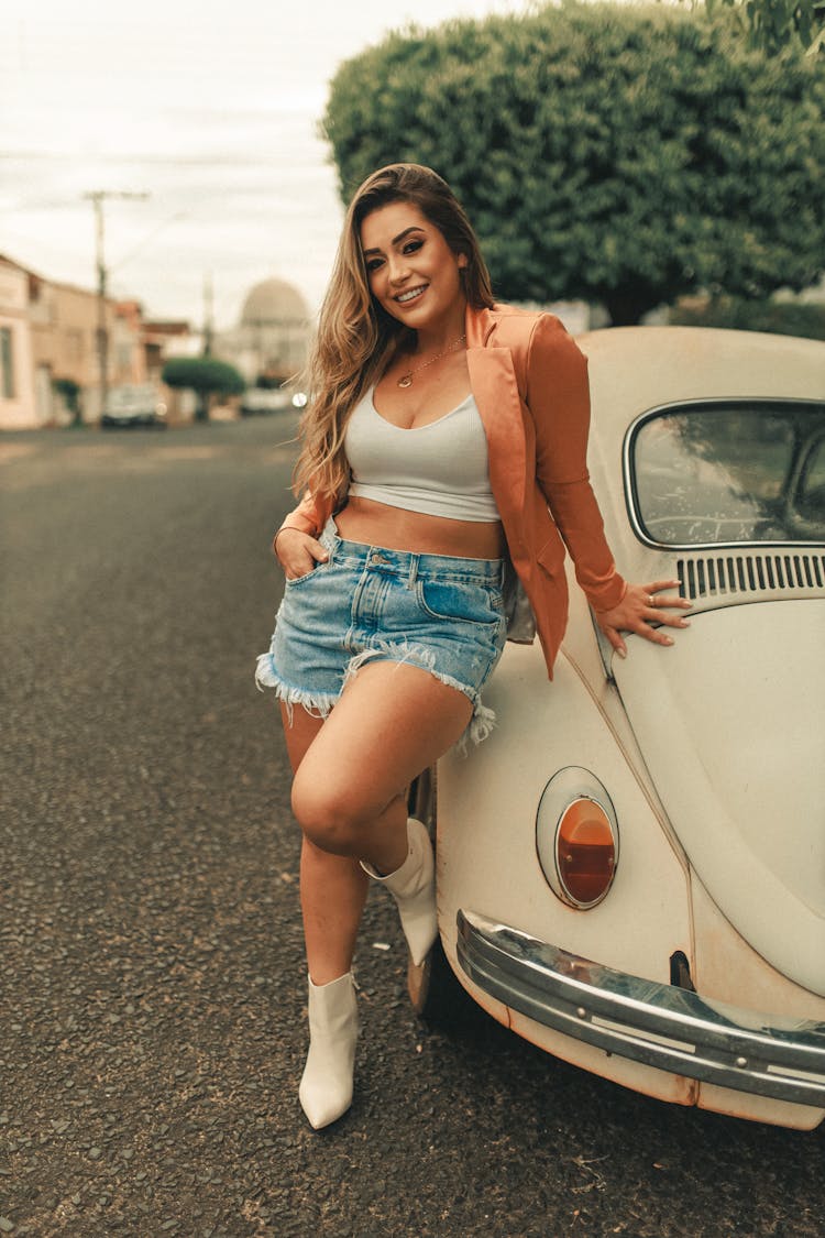 Woman Smiling And Leaning On Car