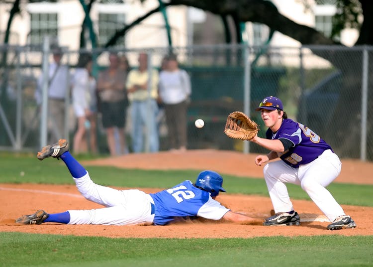 Two Man Playing Baseball During Daytime