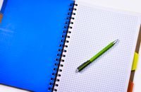Green and Silver Push Pen on White Ruled Paper Indoors