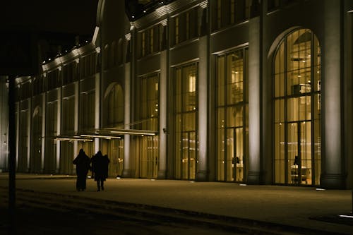 Glass Facade of an Illuminated Building at Night