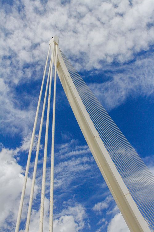 Free Architectural elements of a modern suspension bridge against a vibrant sky in Valencia, Spain. Stock Photo