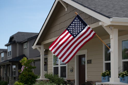 A Flag of the United States of America Hanging on a House