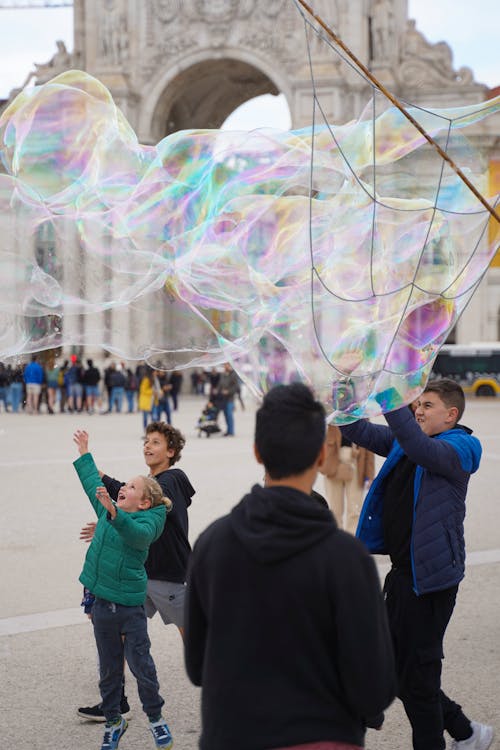 Boys Playing with Soap Bubbles