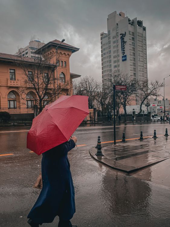 Woman Walking in City with a Red Umbrella · Free Stock Photo