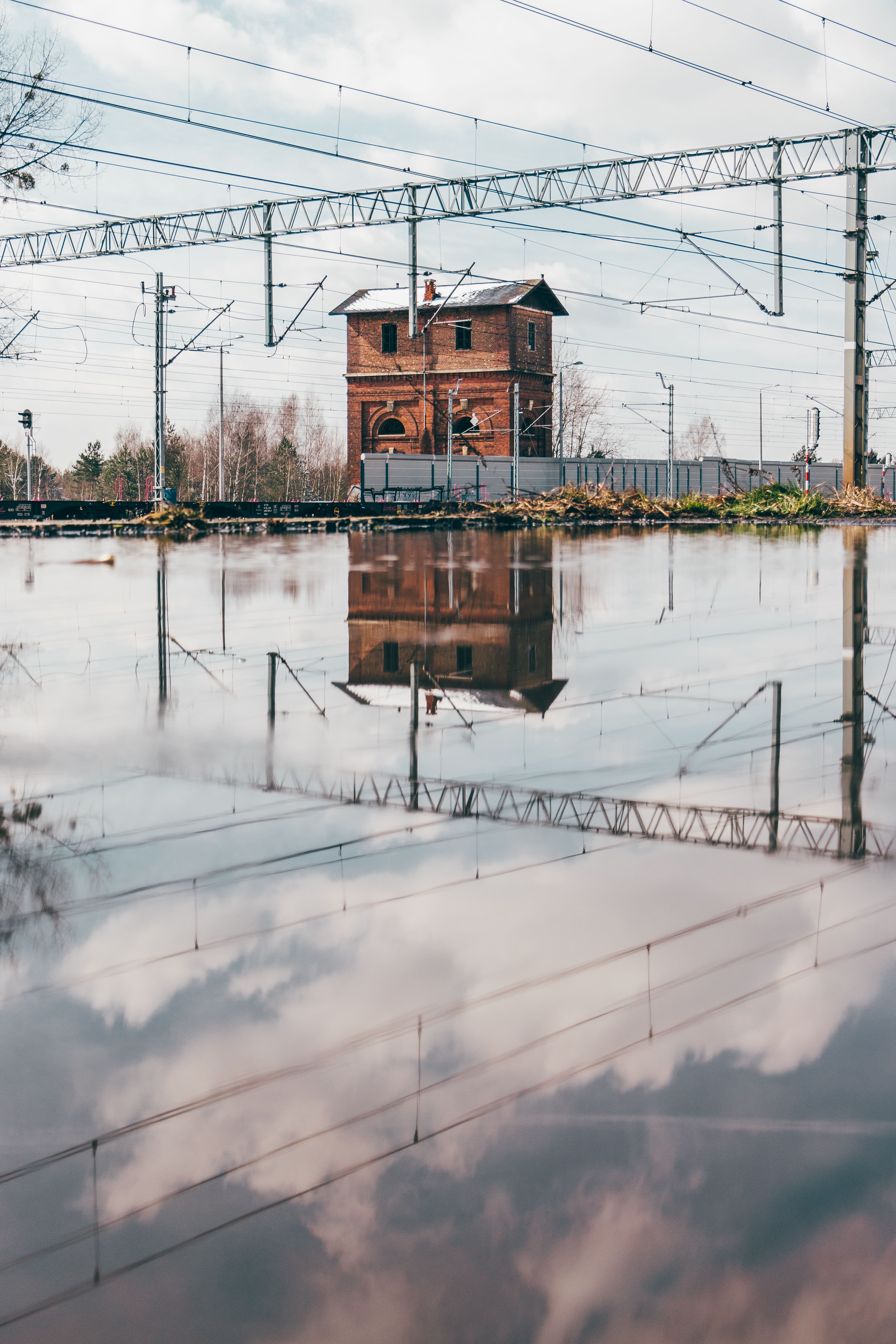View of a Large Puddle near the Railway · Free Stock Photo