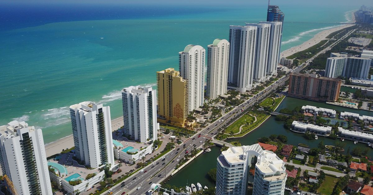Stunning aerial panorama of Sunny Isles Beach's modern skyscrapers along the coastline.