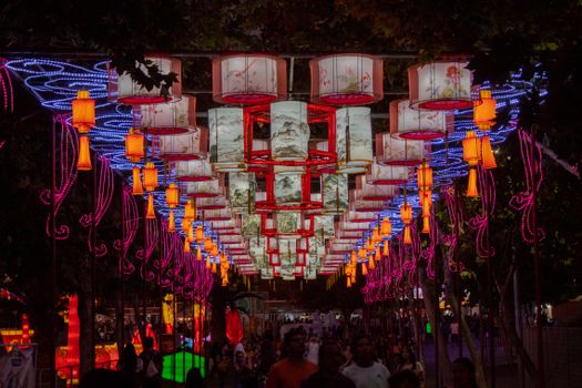 Vibrant lantern display at a bustling night festival in Santiago, Chile.