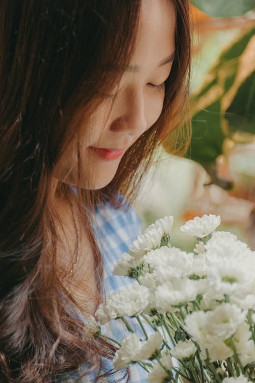 Smiling Woman Holding White Mums Flower Bouquet
