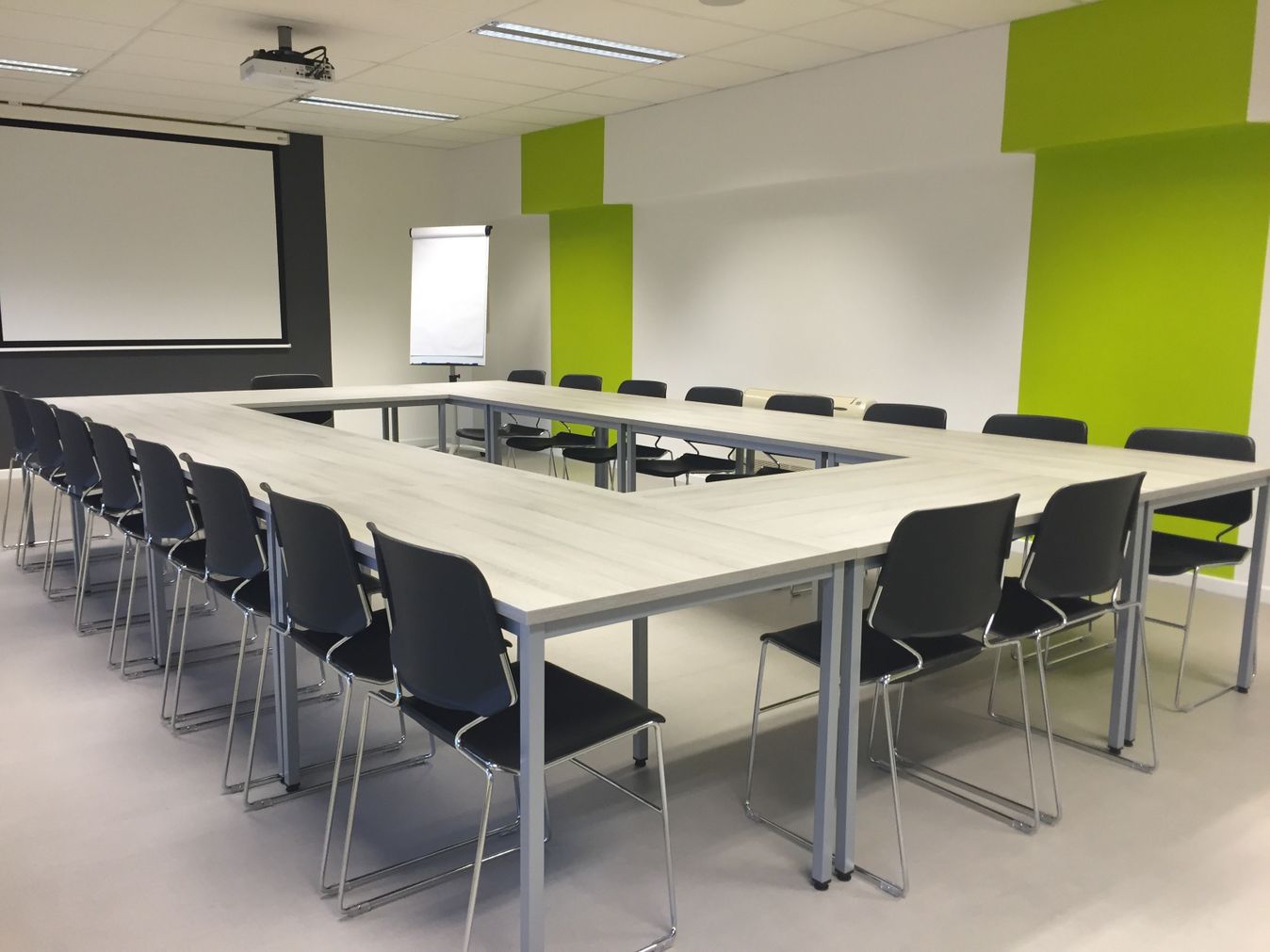 Professional boardroom with enterprise technology display