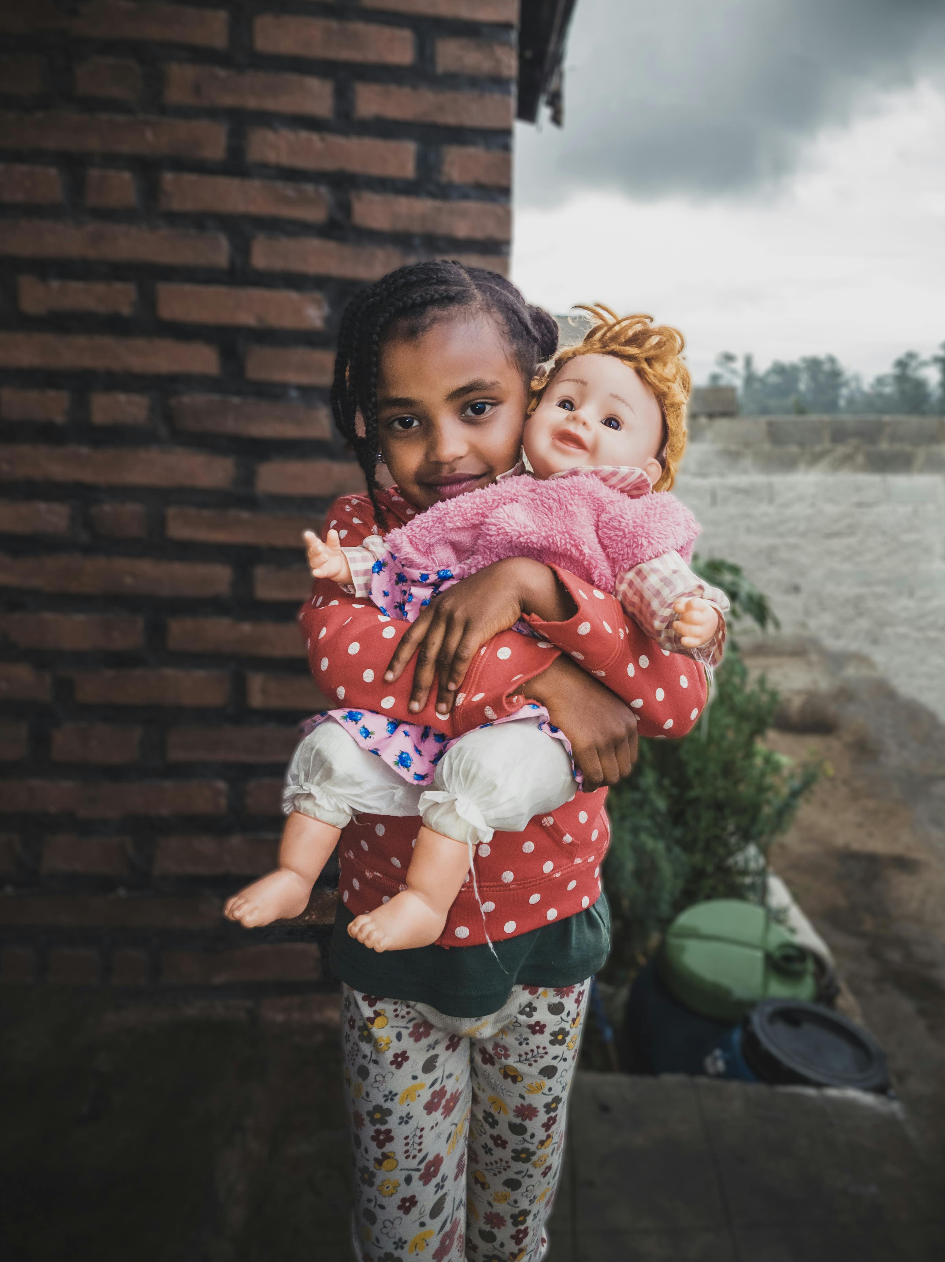 girl posing with doll