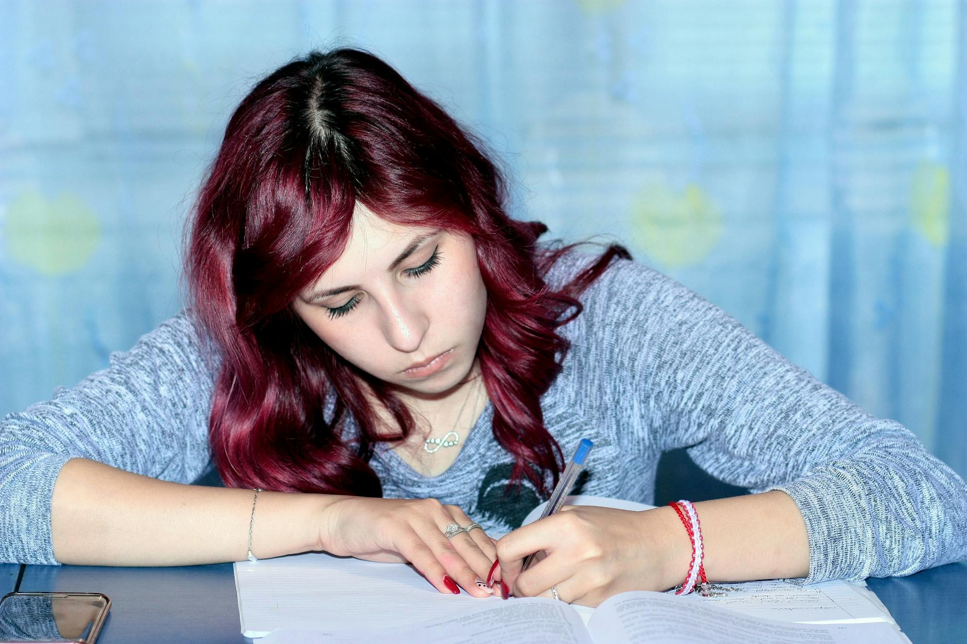 Woman cramming for her test at the library