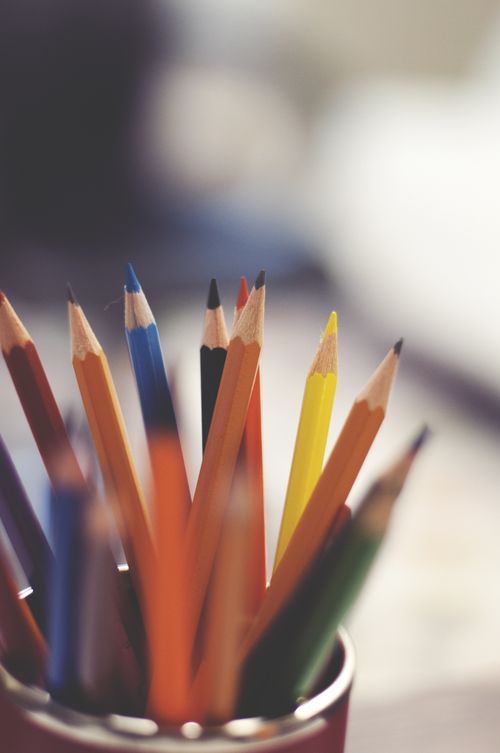 Free A close-up of colorful pencils in a cup, showcasing vibrant colors and creative inspiration. Stock Photo
