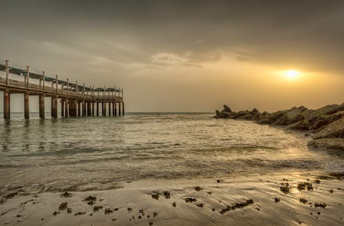 Free stock photo of beach, bridge, cloudscape