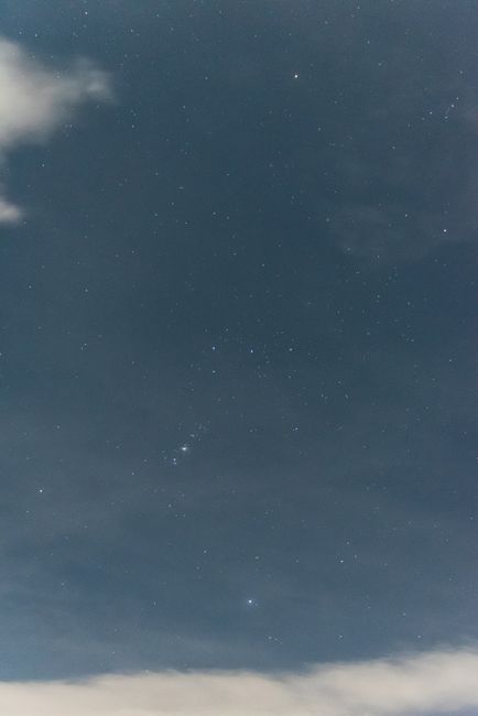 Night sky with stars and soft clouds