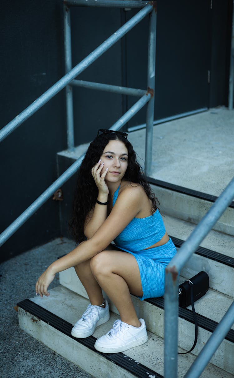 Woman Sitting On Stairs