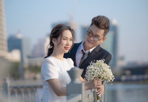 A romantic outdoor portrait of a bride and groom in love, smiling gracefully.