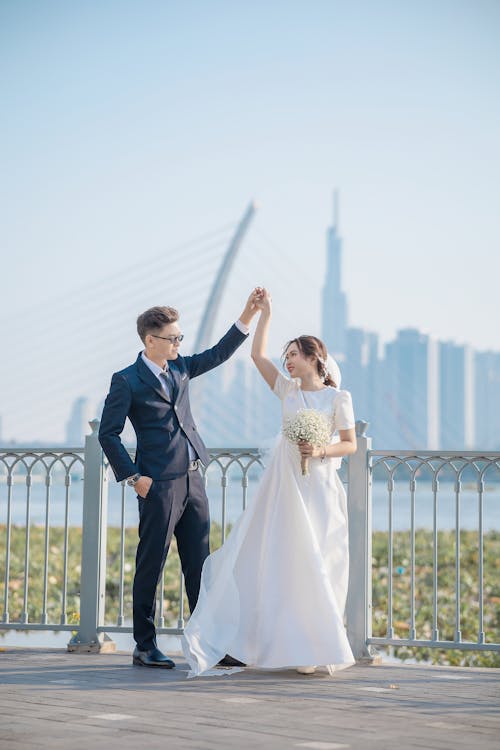 Groom and the Bride Dancing on a Bridge