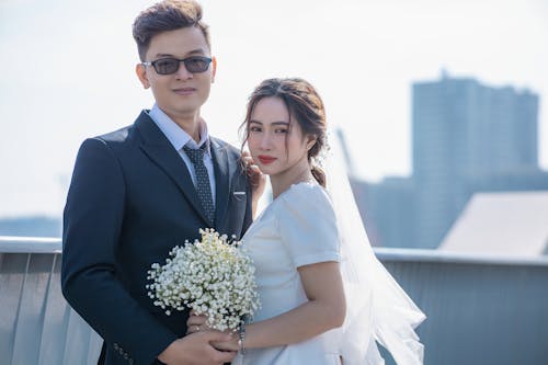 Newlyweds Posing Together Outdoors