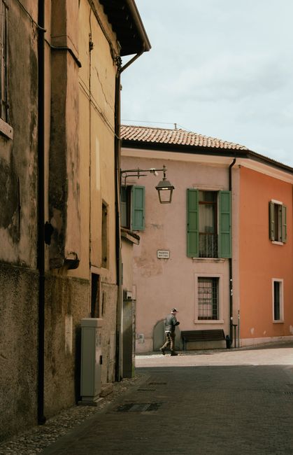 Peaceful street with colorful historic buildings in a European town.