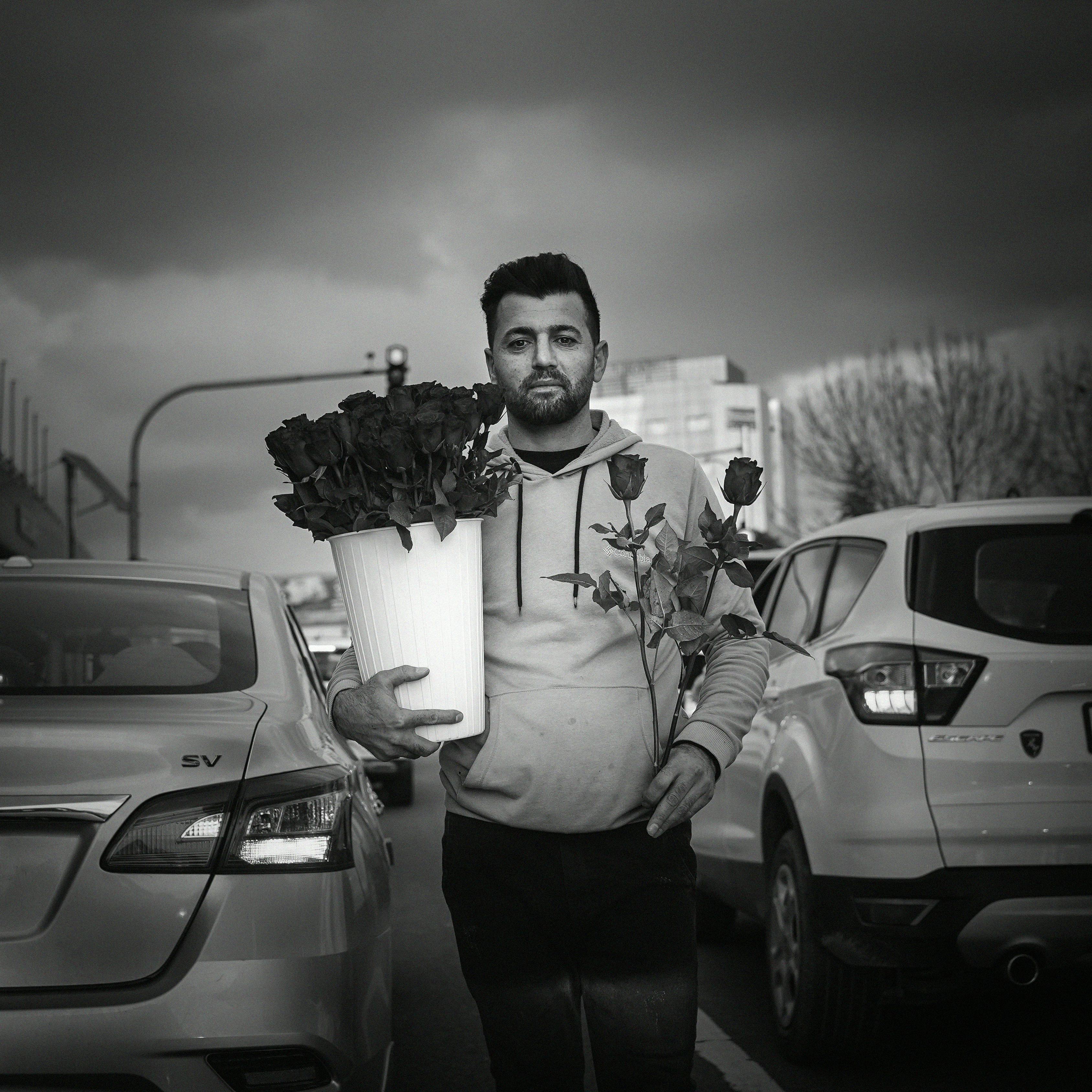 Man Selling Roses on Street