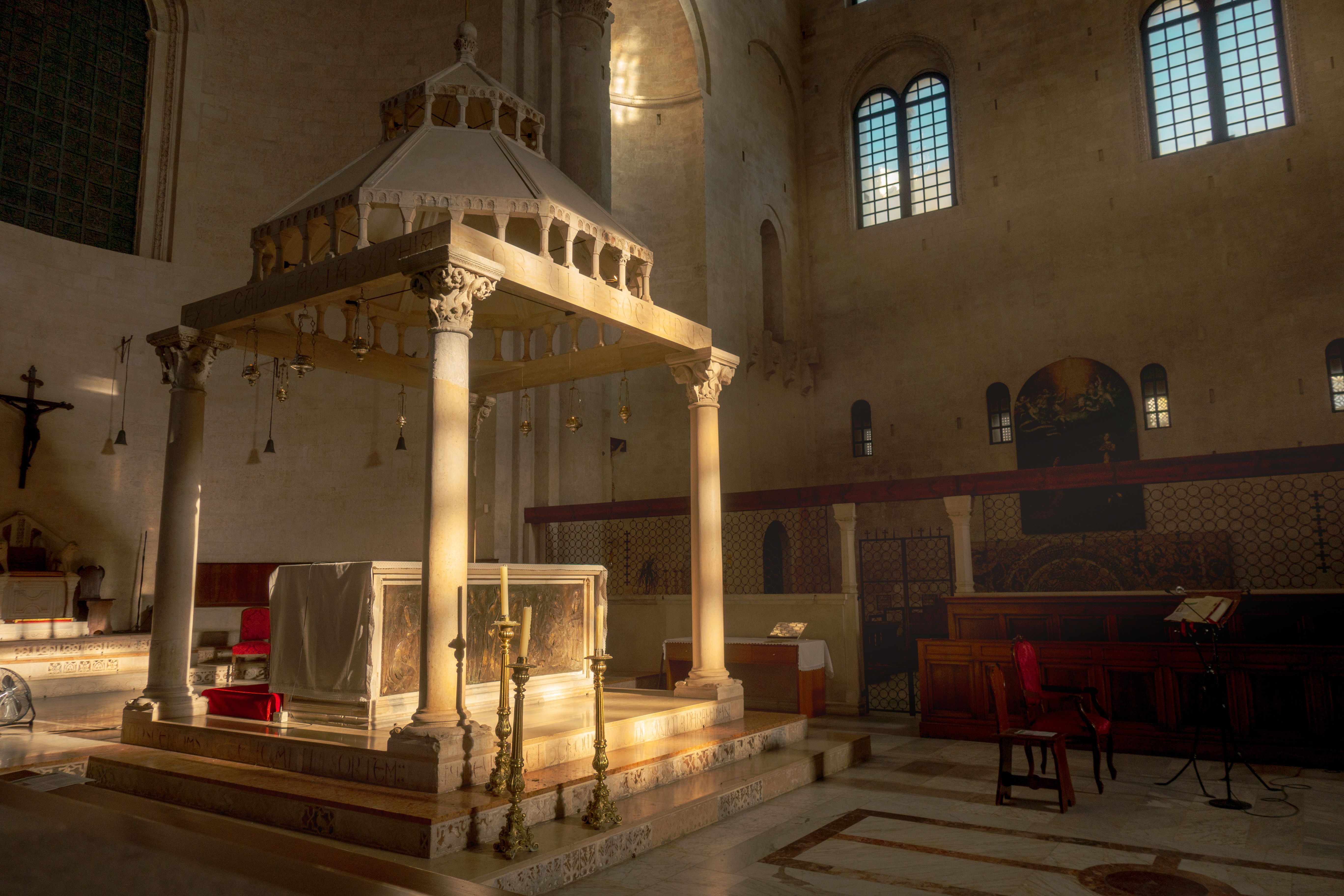Sunlit altar inside a historic church in Bari, Puglia, Italy.