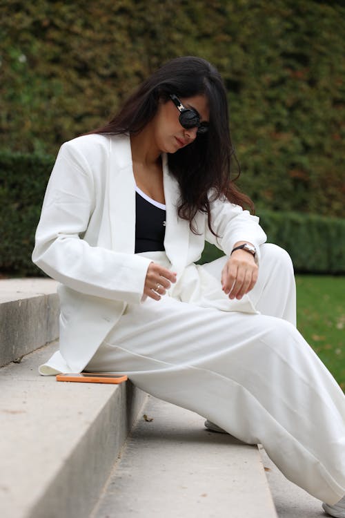 Woman Posing in White Suit