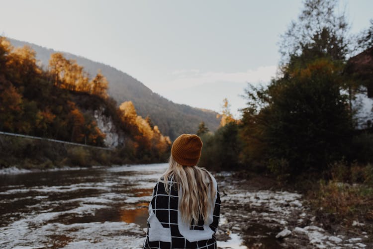 Blonde Woman Sitting On River