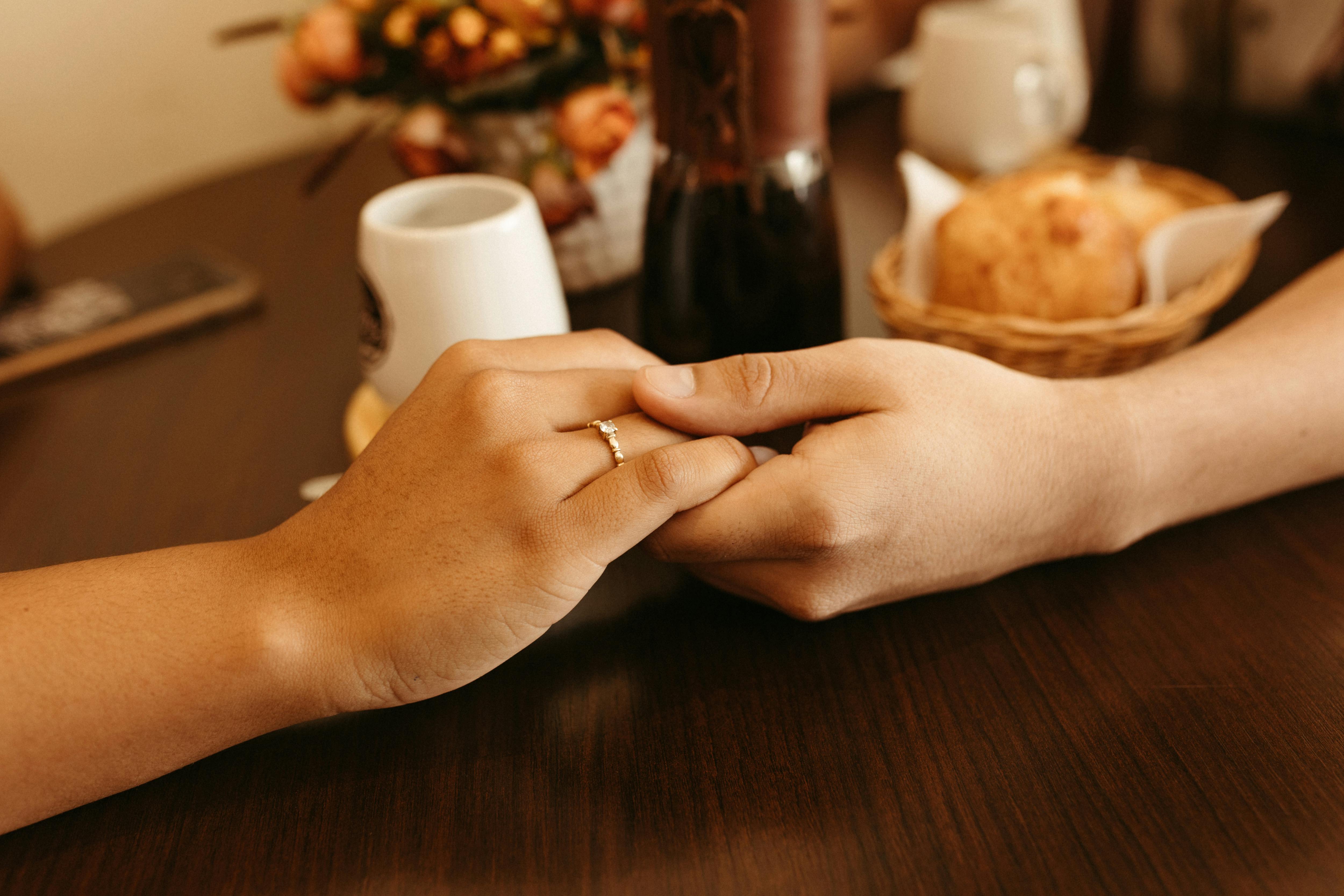 Closeup of a Couple Holding Hands · Free Stock Photo