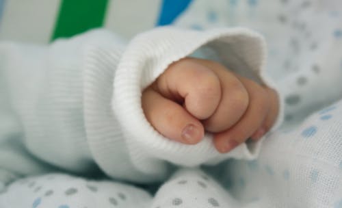 Baby Wearing White Long-sleeved Shirt