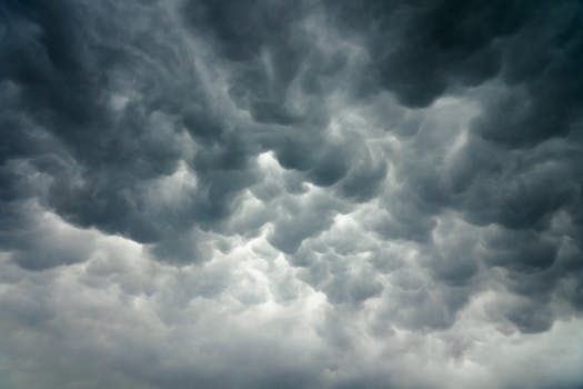 Dramatic storm clouds looming over Sanand, India, capturing the power of extreme weather.