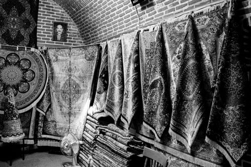 Free Carpets in Grand bazaar of Tabriz  Stock Photo