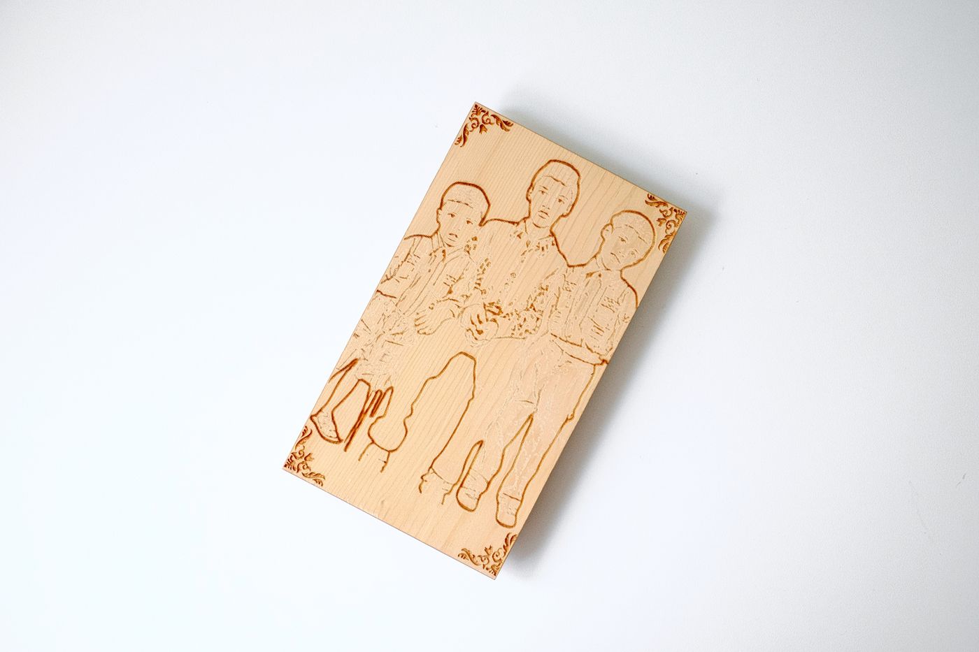 Engraved wooden plaque with detailed portrait