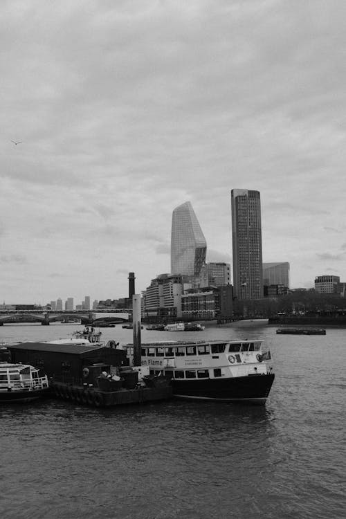 Ship Moored on River in City in Black and White