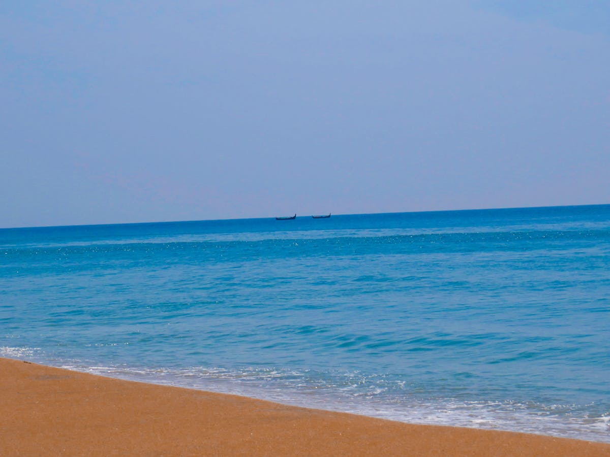 Fashionable woman holding a structured handbag while wearing a stylish outfit