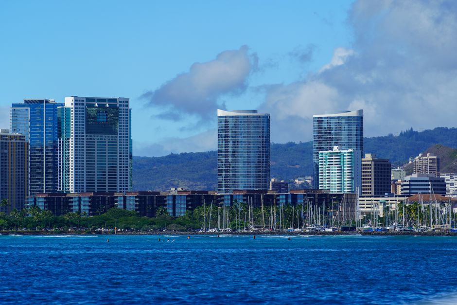 Stunning Ohana Yachts Sport Fishing & Luxury Charters Review: The Ultimate Oahu Ocean Adventure Review 2026 - Captivating view of Honolulu's skyline with boats in the harbor, perfect for travel and urban themes.