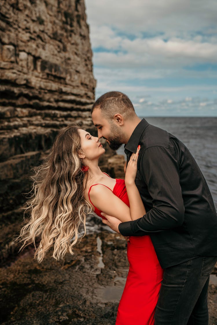 Embracing Couple On A Beach 