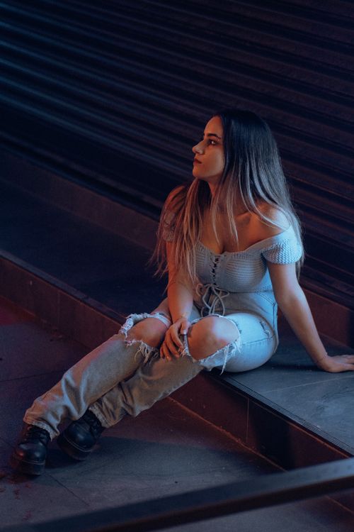 woman wearing off shoulder top and dark jeans date night