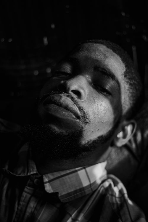 Free Artistic black and white portrait of a man with a beard in dramatic shadow lighting. Stock Photo