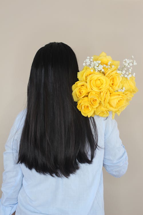 Brunette with Yellow Roses